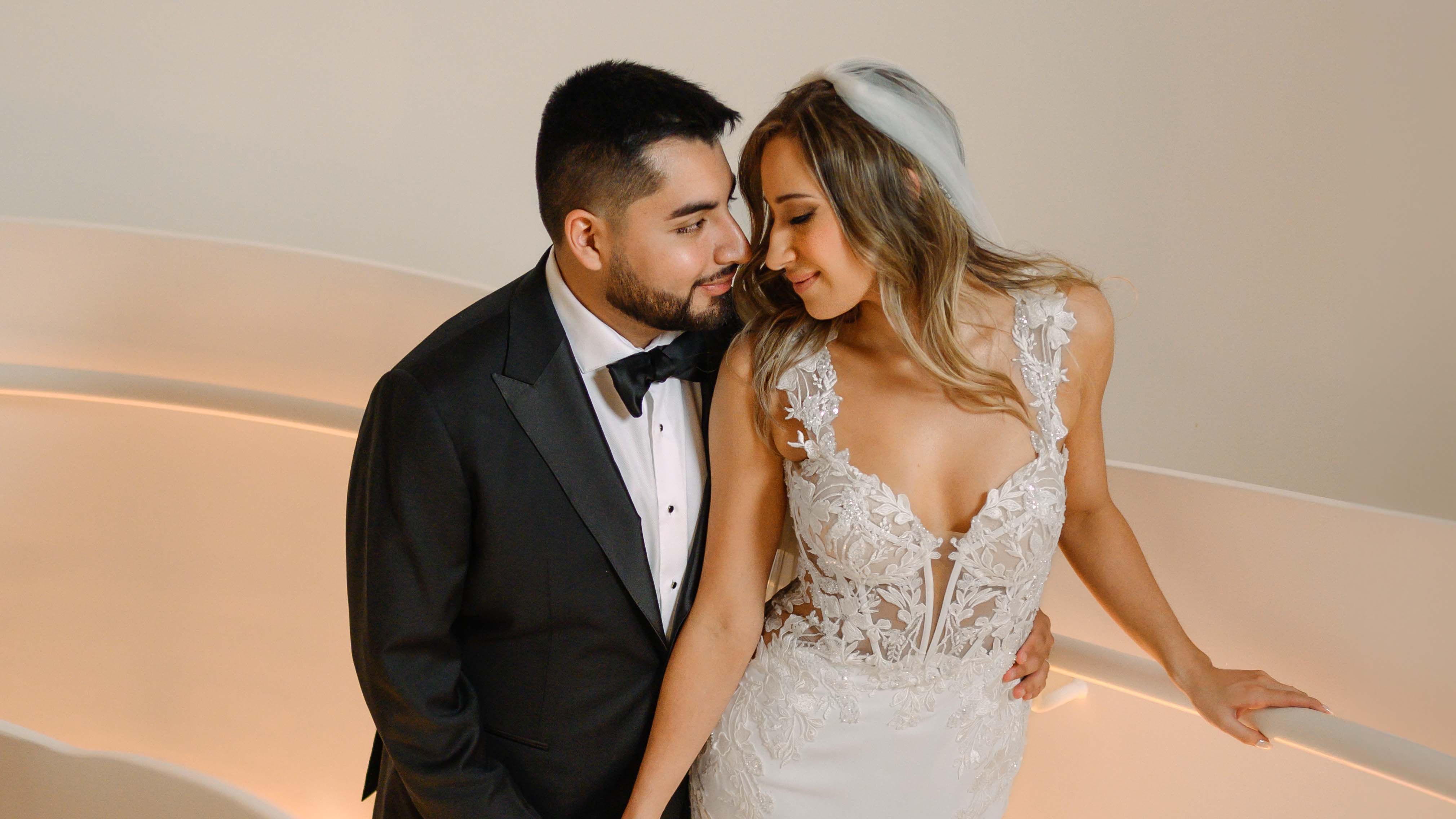 Newlywed couple sharing a moment on a staircase